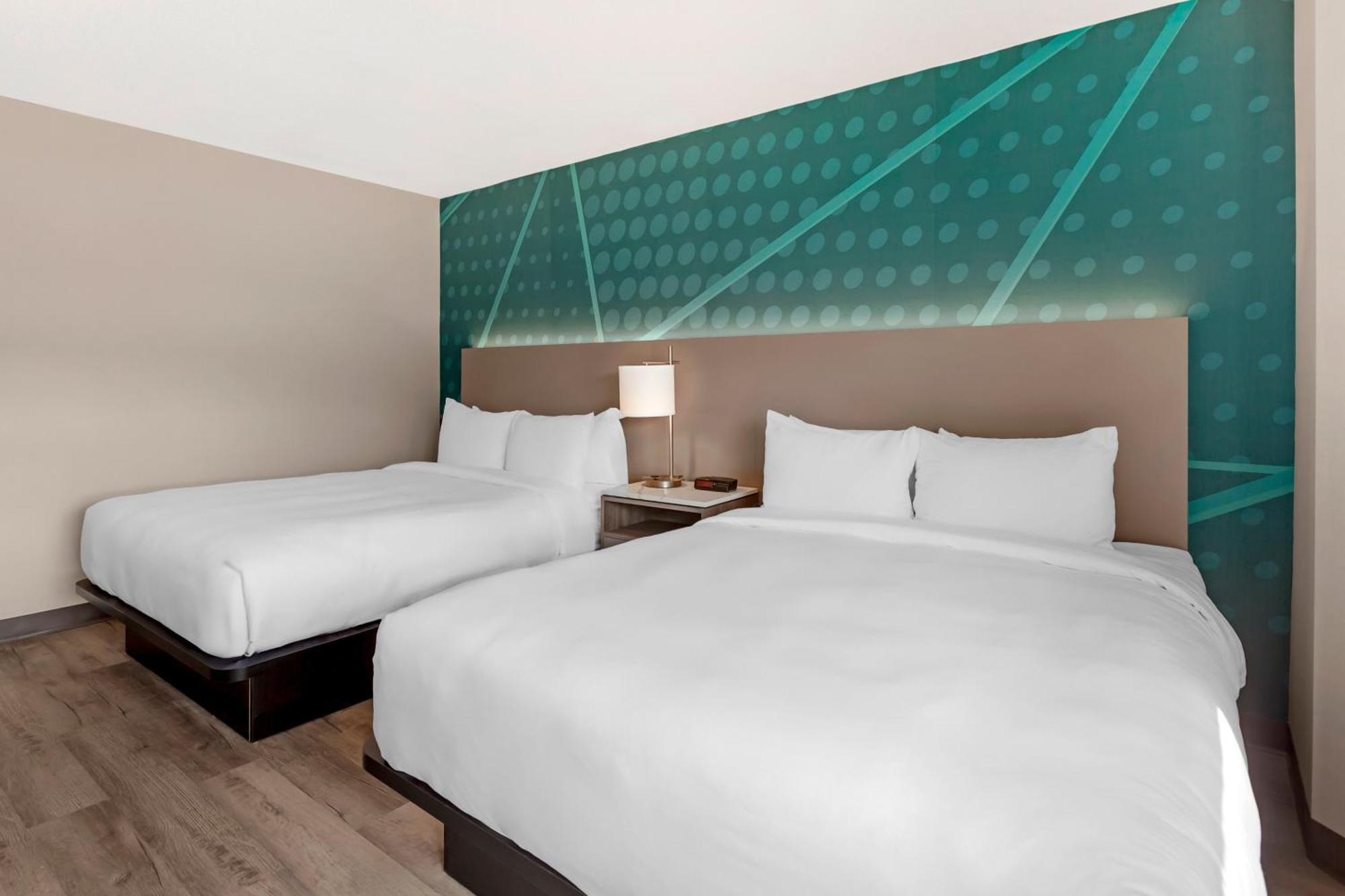 Quadruple Room Two Queen Beds Non Smoking or Upper floor or Interior Corridor