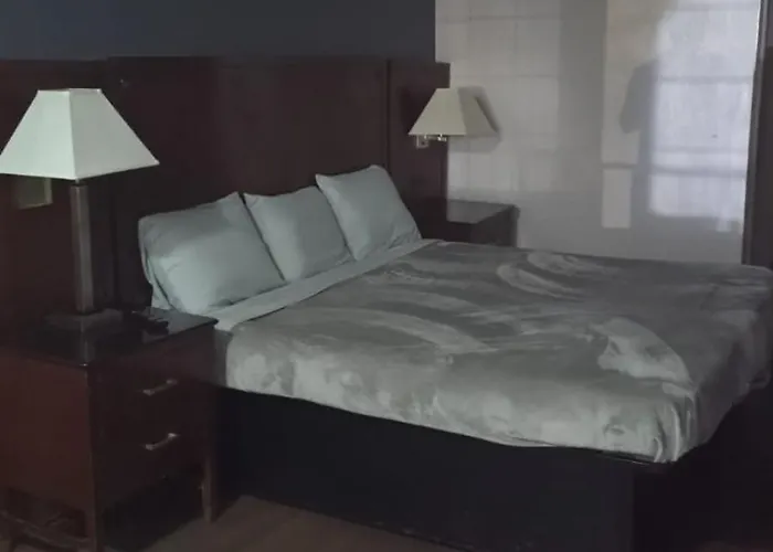Queen Bed Hotel Suite 127